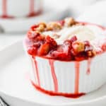 Strawberry crumble with melted ice cream