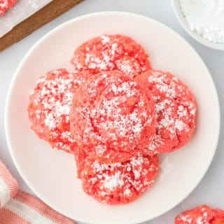 A plate of raspberry gooey cookies on the table.