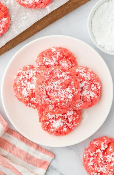 A plate of raspberry gooey cookies on the table.