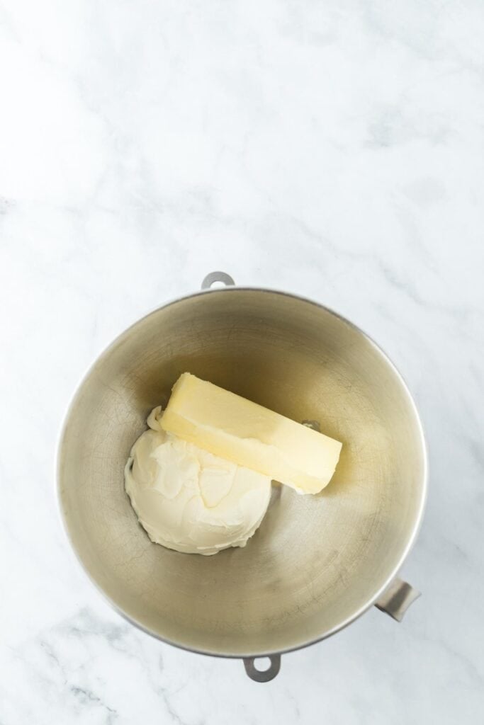 Butter and cream cheese in a stand mixer bowl