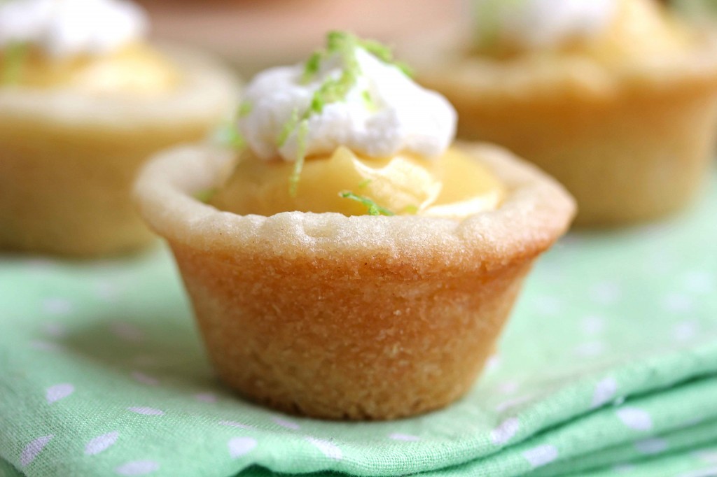 Close up of one key lime pie cookie cup with a couple more in the background