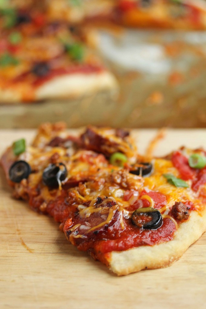 Close up of a slice of chorizo pizza.
