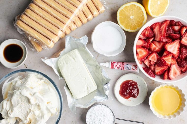Ingredients to make strawberry tiramisu on the table.