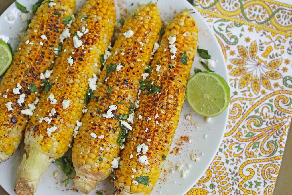 Close up of four ears grilled Mexican corn