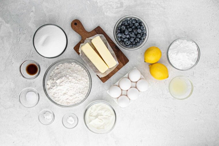 Ingredients to make lemon blueberry pound cake on the table before mixing.