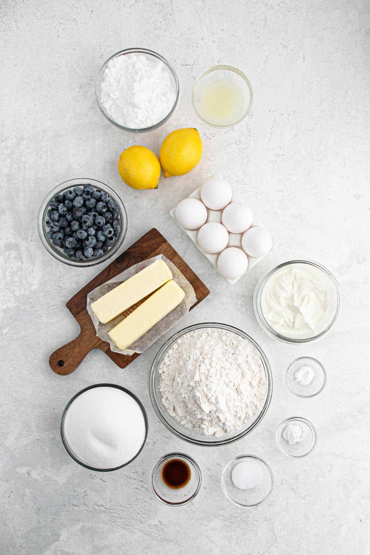 Ingredients to make lemon blueberry pound cake on the table before mixing.