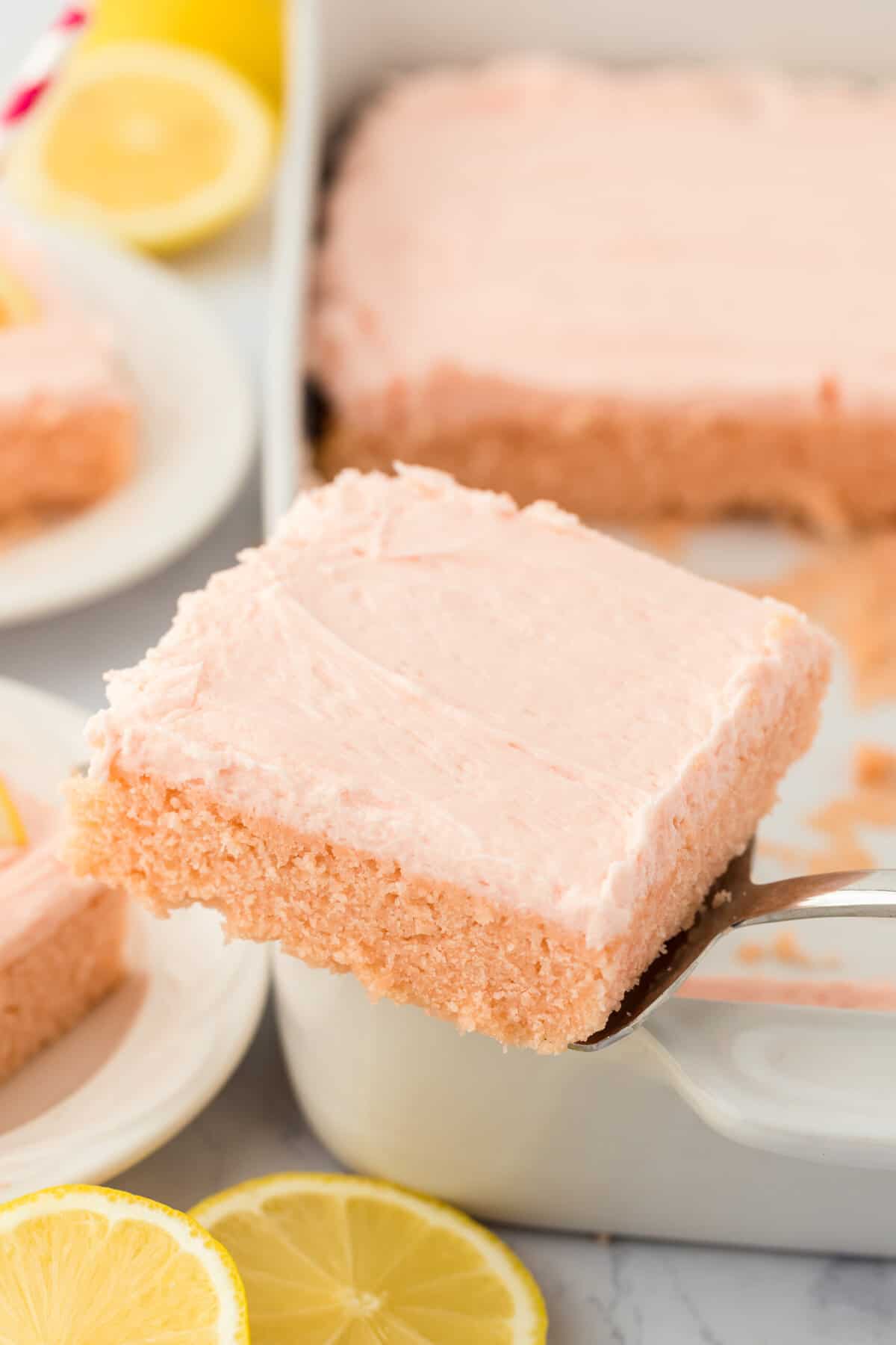 a square slice of pink lemonade cake.