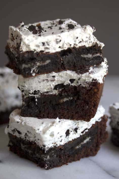 Close up of three cookies and cream brownies stacked on top of each other