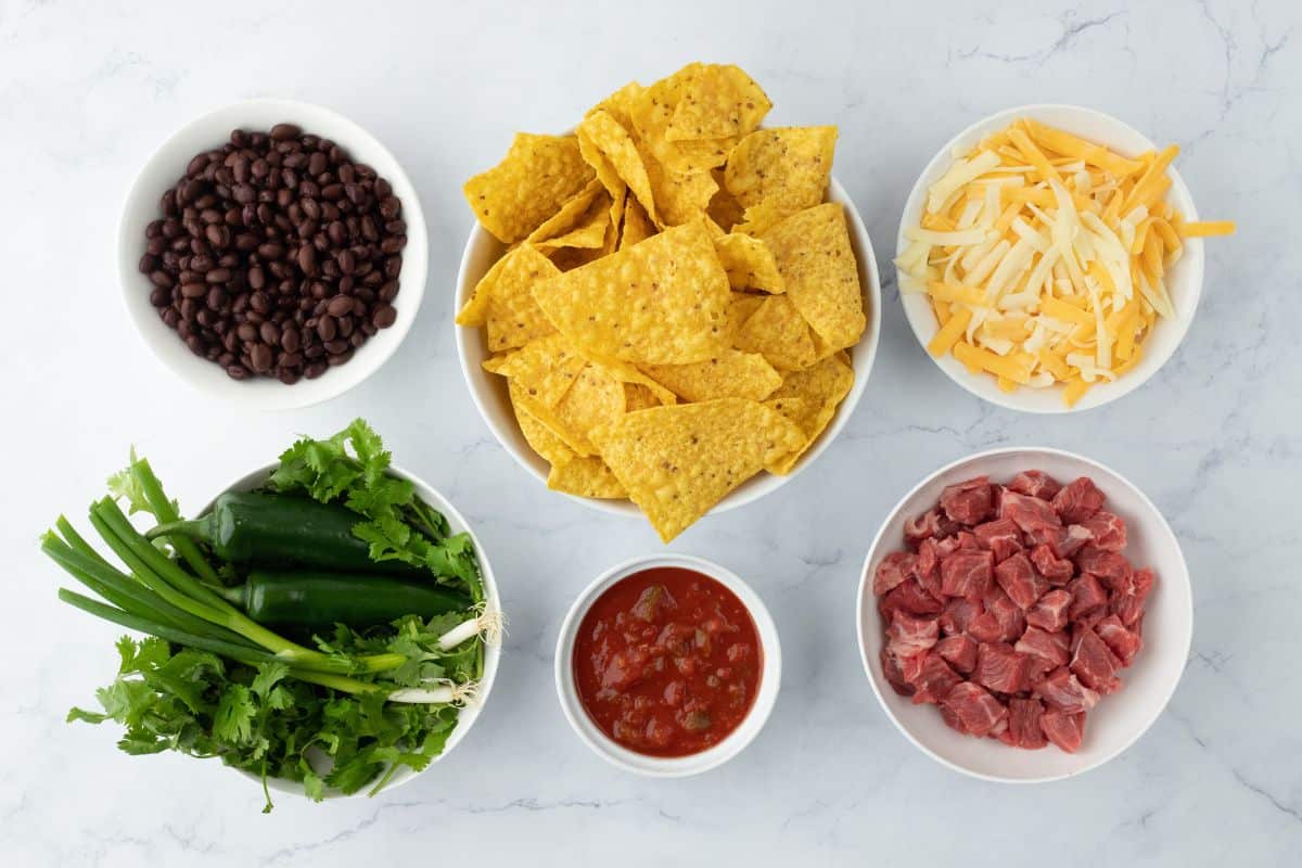 Ingredients to make steak nachos on the table before making them.