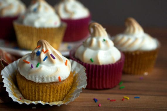 Delicious sweet potato cupcakes with marshmallow frosting and sprinkles ready to enjoy