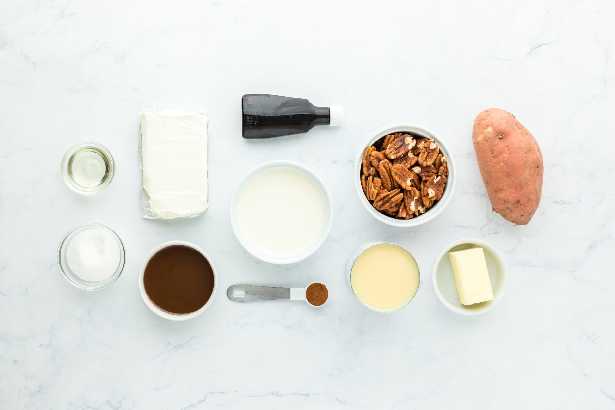 Sweet potato, pecans, cream cheese, butter, vanilla on white background