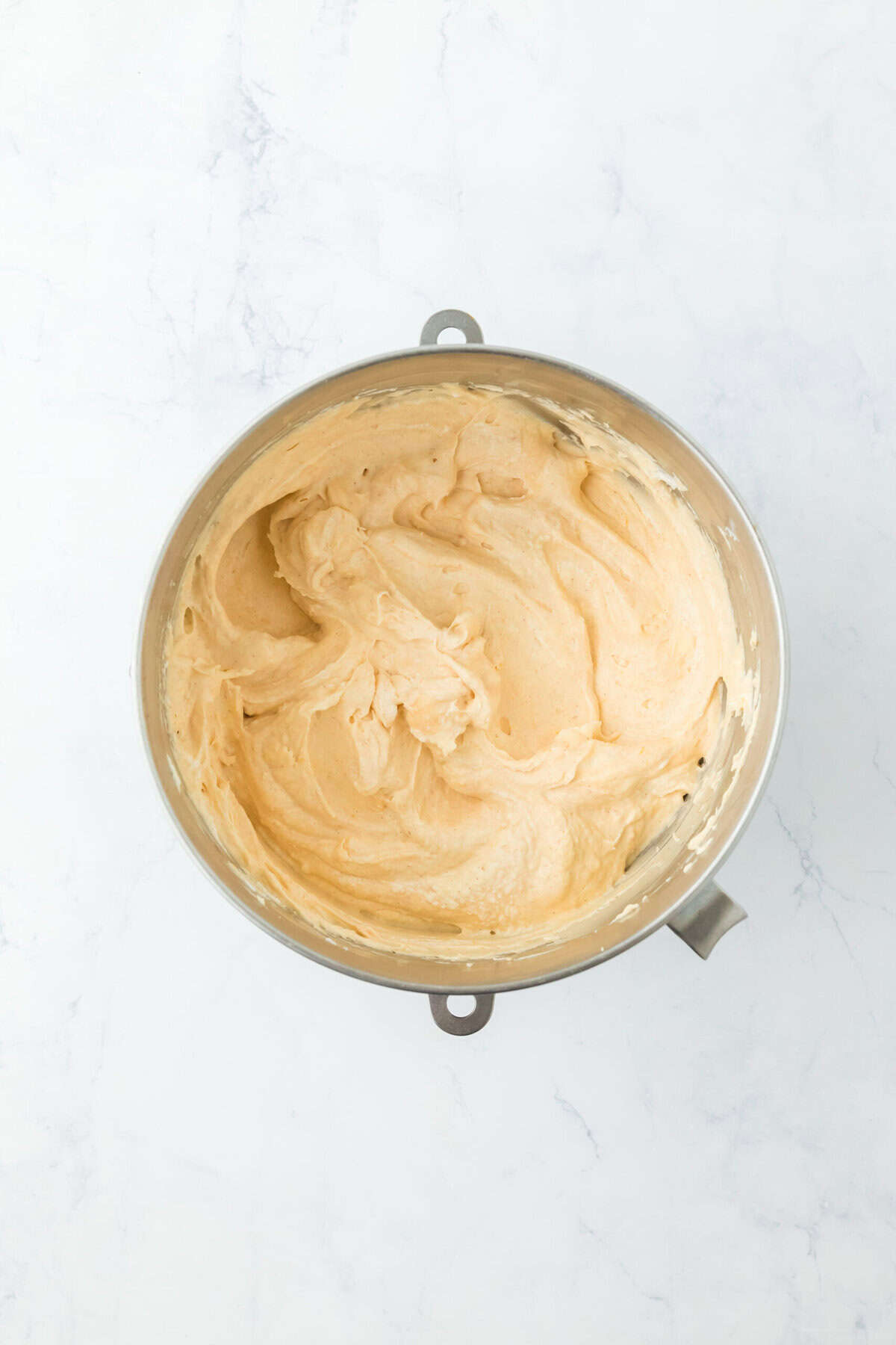 Smooth sweet potato ice cream base on white countertop