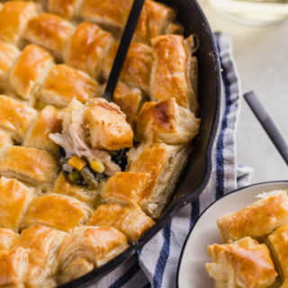 Easy chicken pot pie being scooped with a spoon