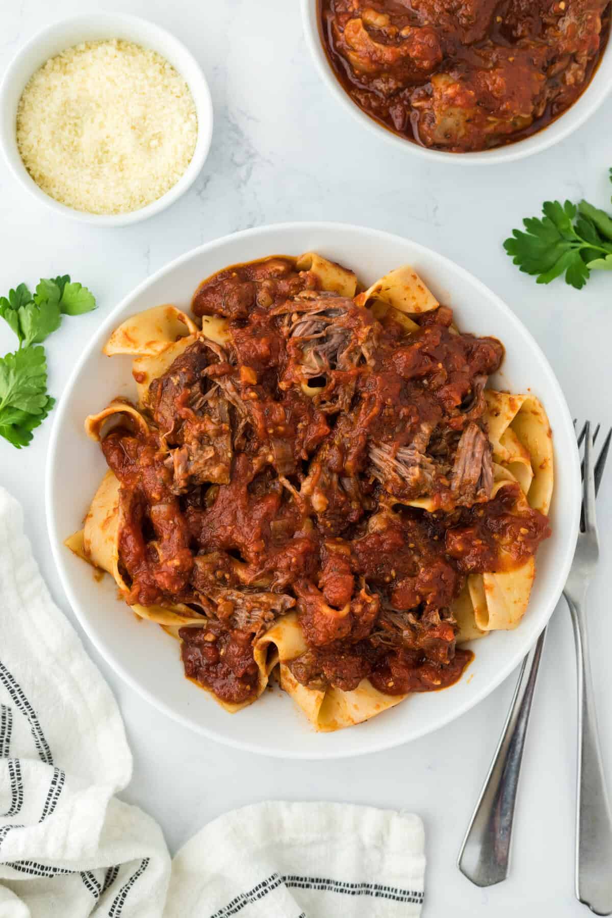 Beef ragu sauce over pasta ready to serve