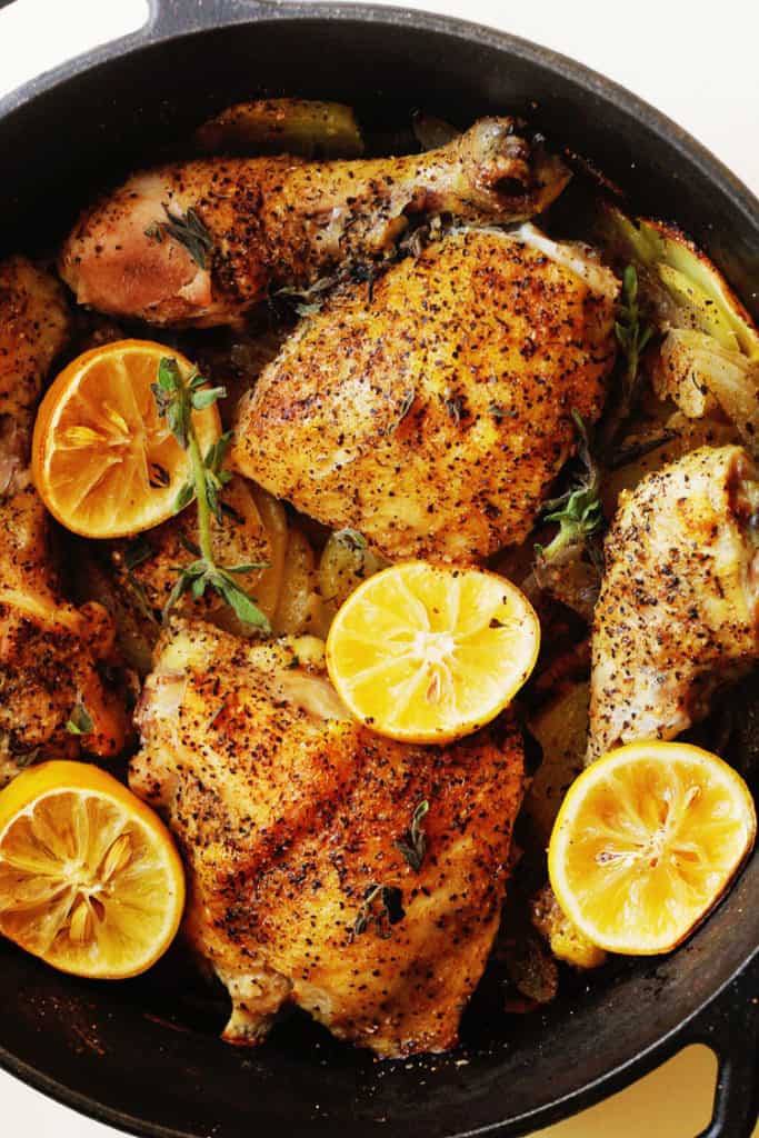 Lemon Roasted Chicken and Potatoes in a dutch oven ready to serve. 