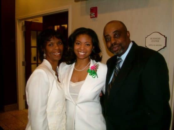 Jocelyn Delk Adams, center, posing for a photo with her parents