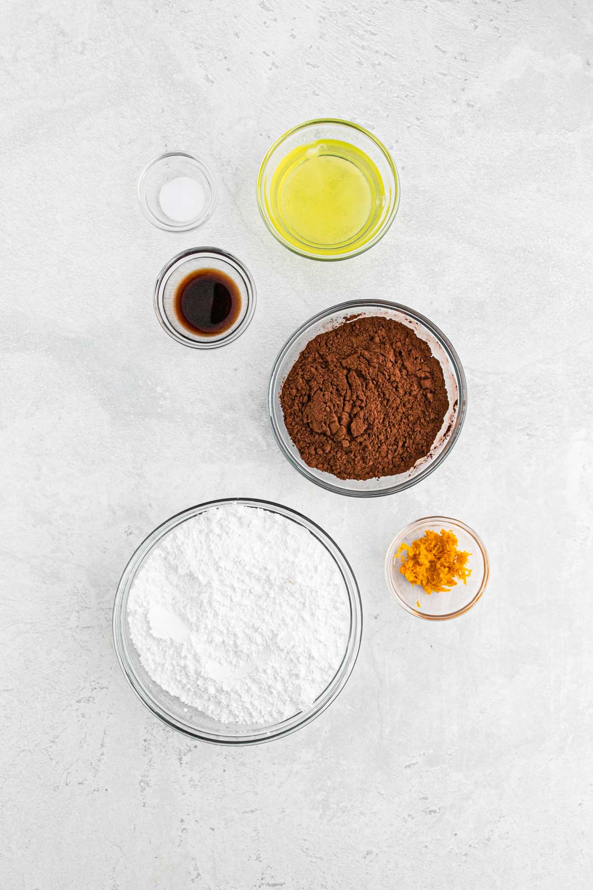 Ingredients to make chocolate orange cookies on the table.