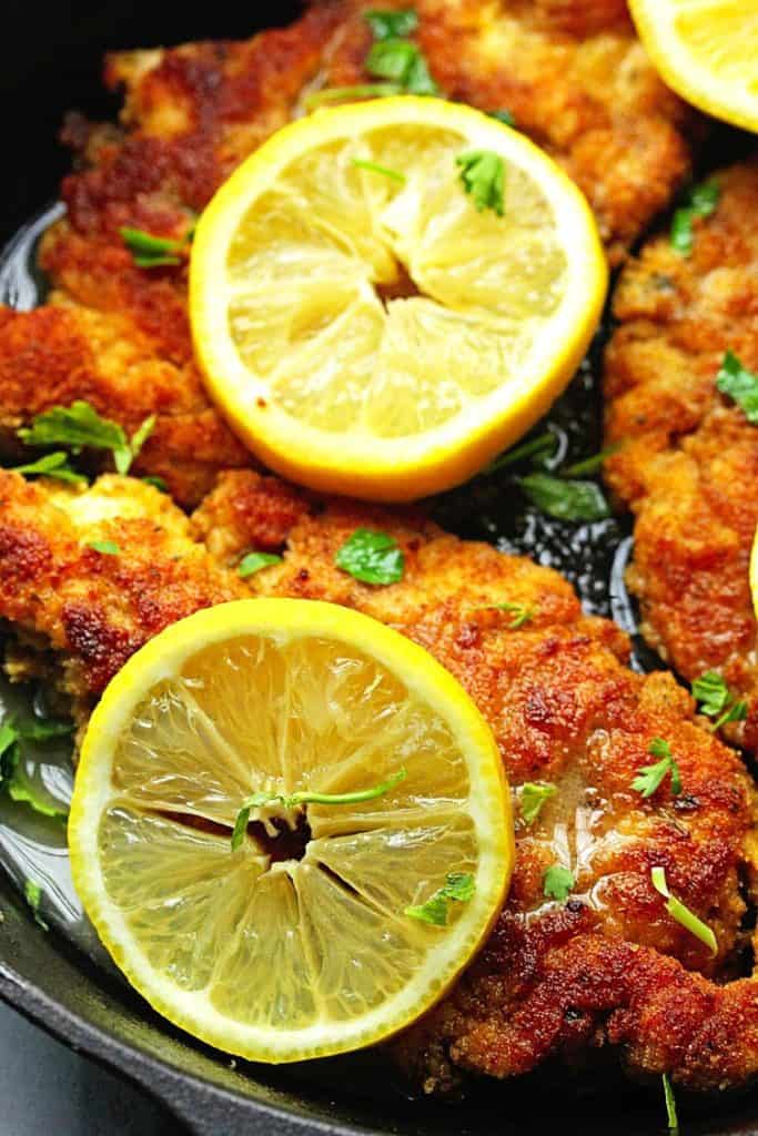 A close up of chicken piccata in lemon sauce ready to serve for dinner