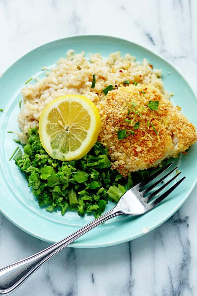 Lemon Panko Fish surrounded by rice and broccoli pieces