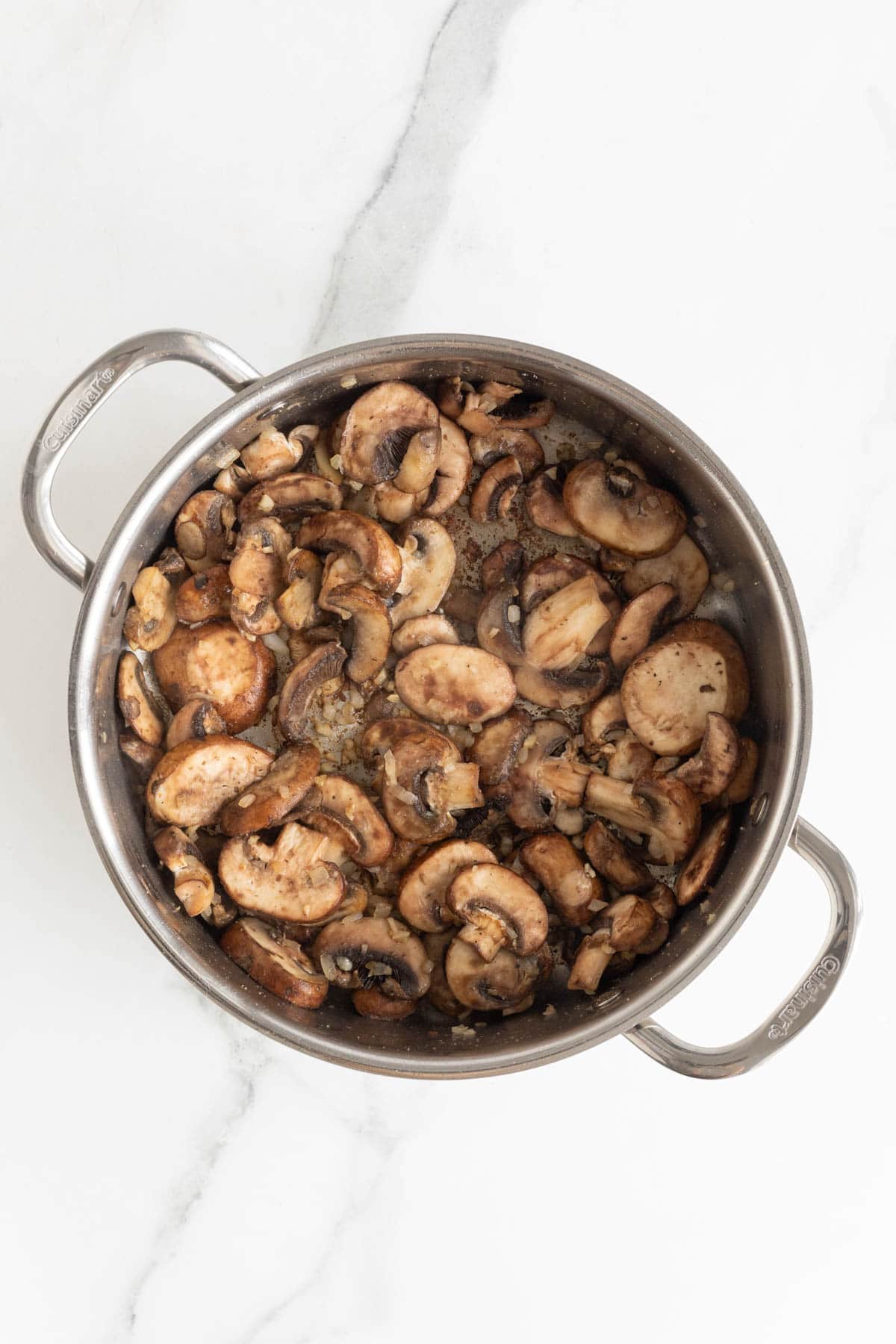 Sauteed mushrooms in a large skillet to make chicken marsala