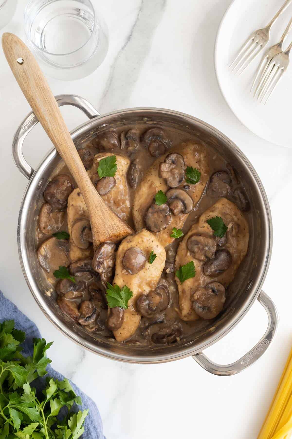 Finished chicken marsala with mushrooms and sauce garnished with parsley, ready to serve