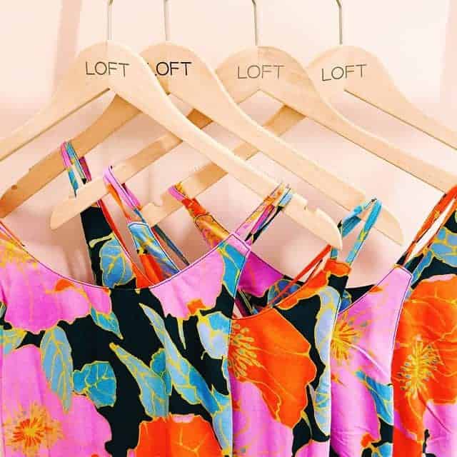 The Loft Floral Maxi Dresses hanging on wooden hangers