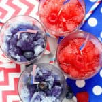 Red and blue snow cones on a white background with patterned napkins