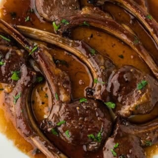 Perfect lamb chops recipe on a white plate close up