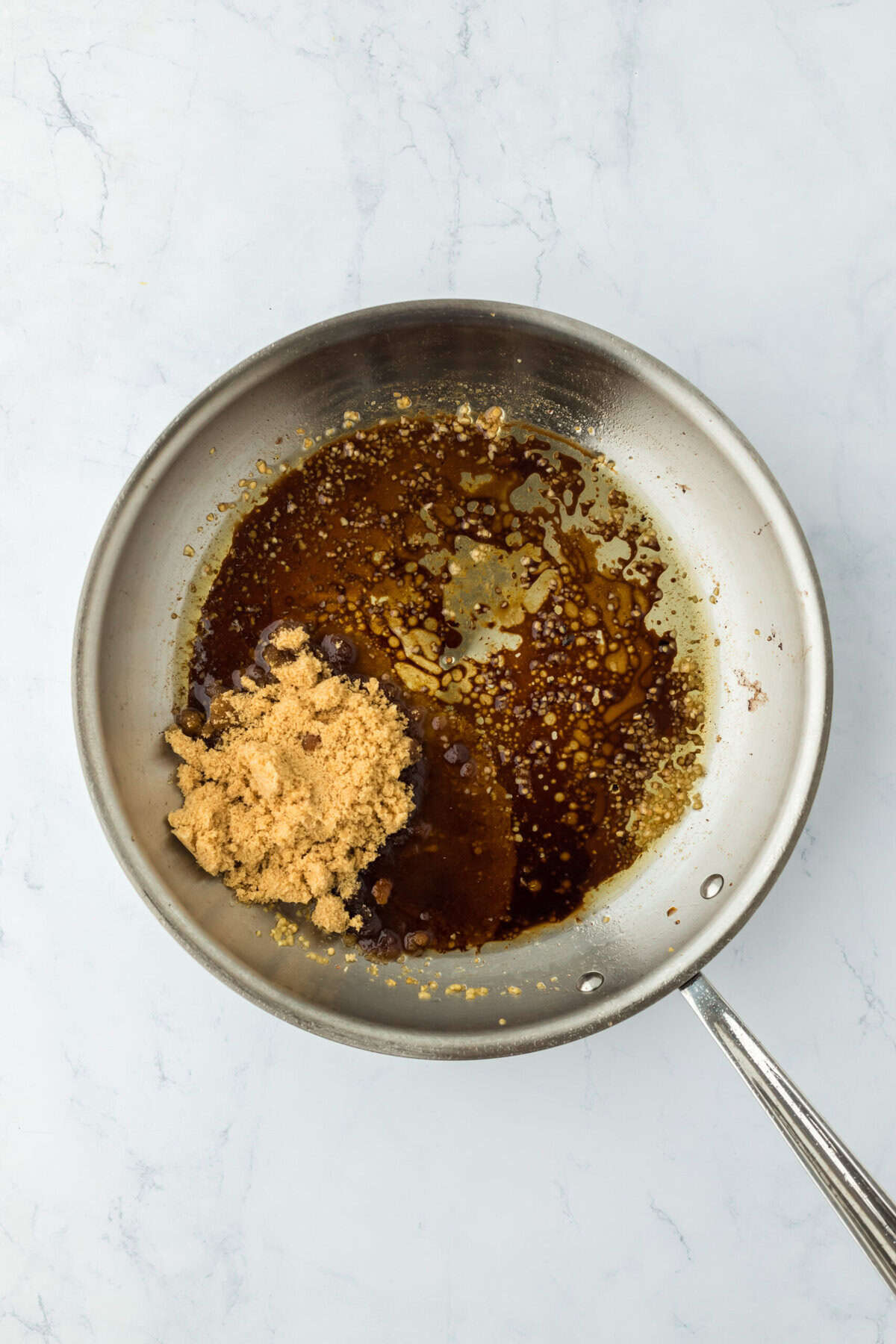 Garlic, balsamic vinegar, spices and brown sugar in a skillet.