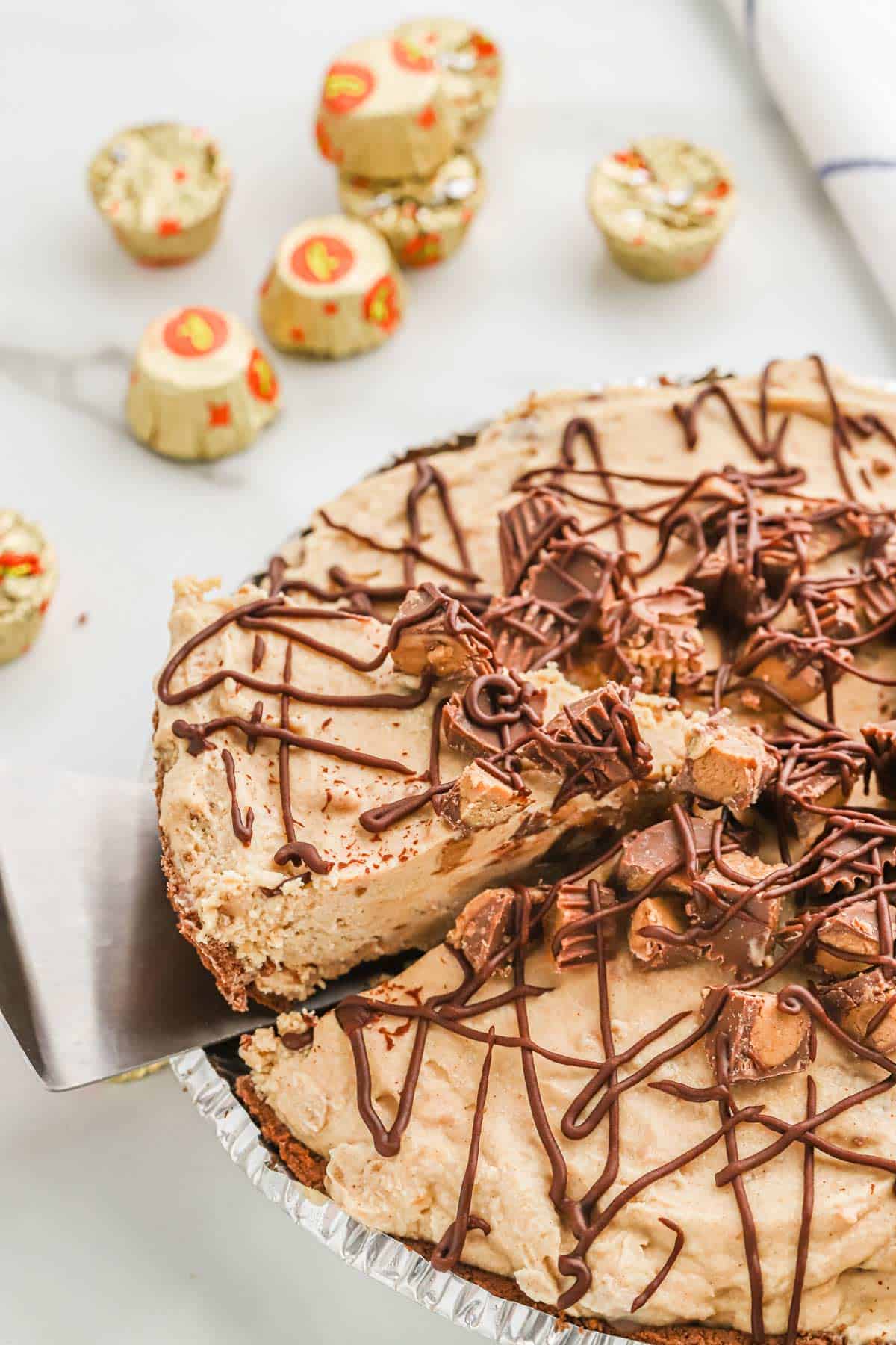 Frozen Peanut Butter Pie with a slice being lifted out