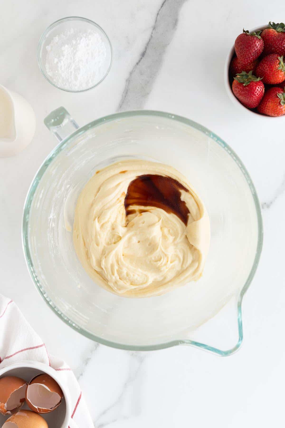 Vanilla extract added to the mixed batter, emphasizing the smooth and rich texture