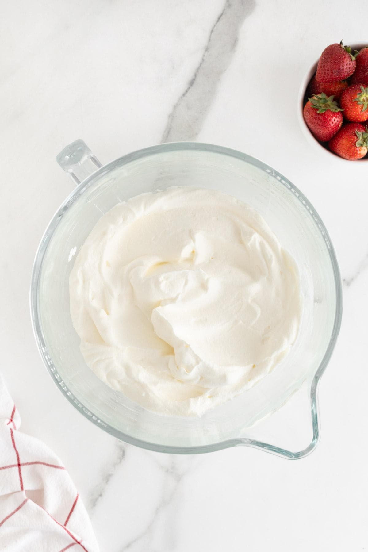 Smooth, fluffy whipped cream in a bowl