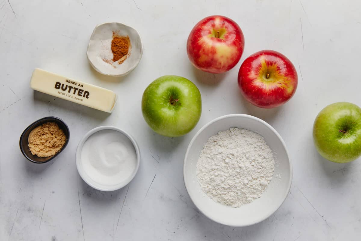 Ingredients to make baked apples with crumb topping on the table.