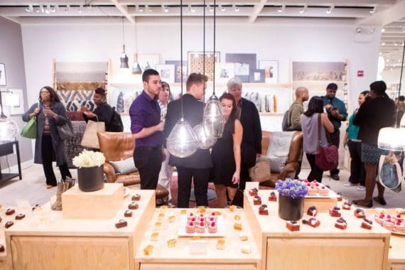 Photo of attendees and pastry display