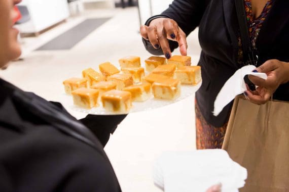 Waiter handing out dessert samples