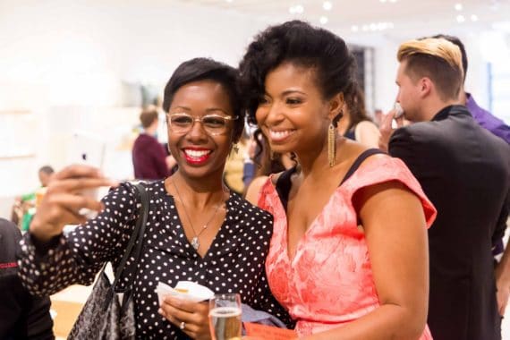 Jocelyn Delk Adams posing for a selfie with an attendee