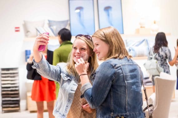 Two launch party attendees taking a selfie