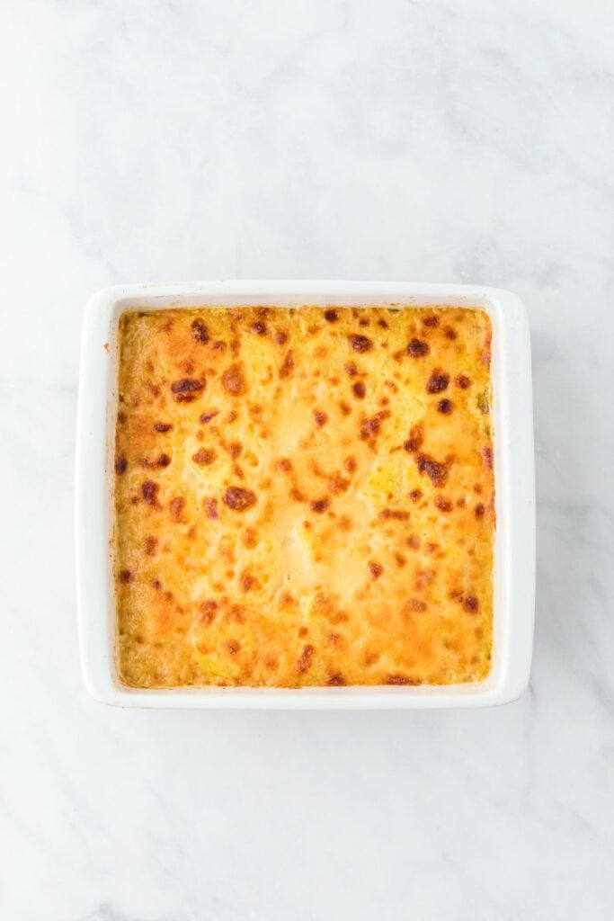 A square, golden-browned potato and squash gratin with a crispy top layer