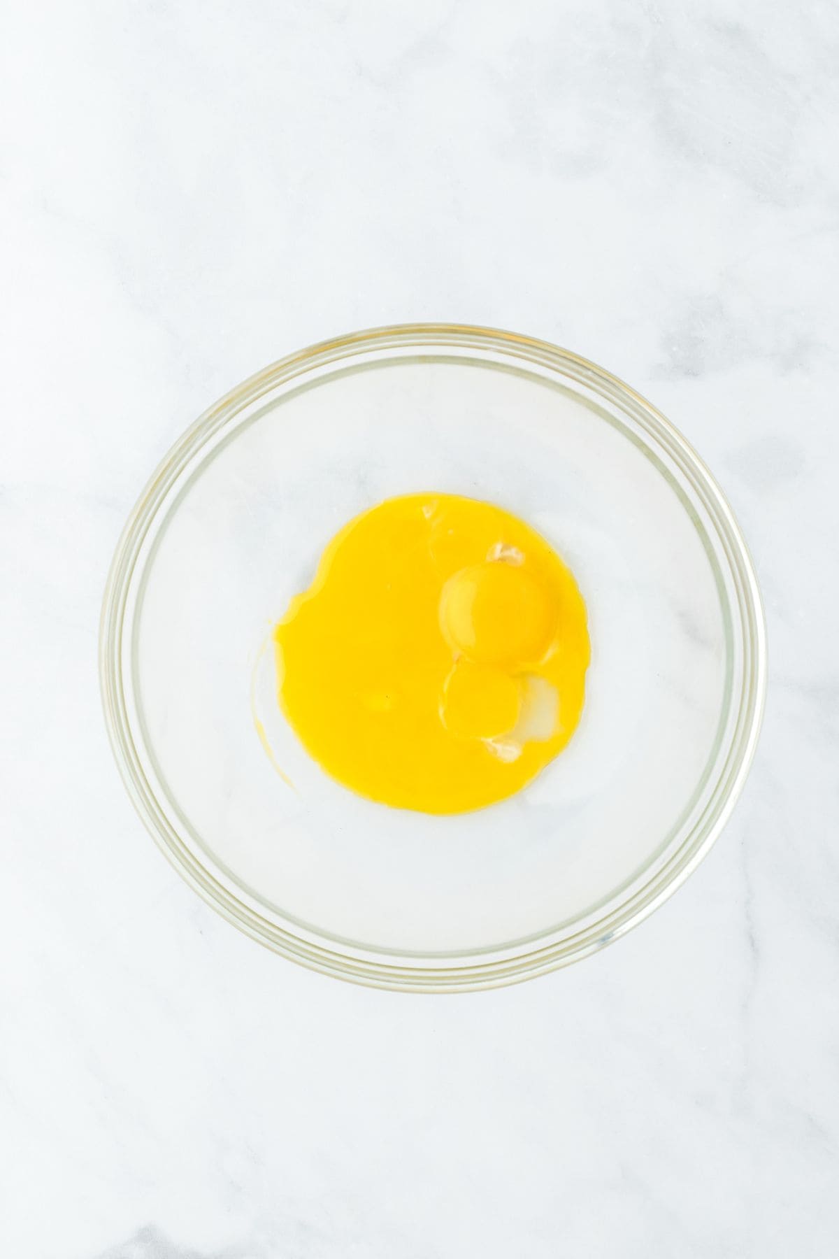 Egg yolks in a glass bowl