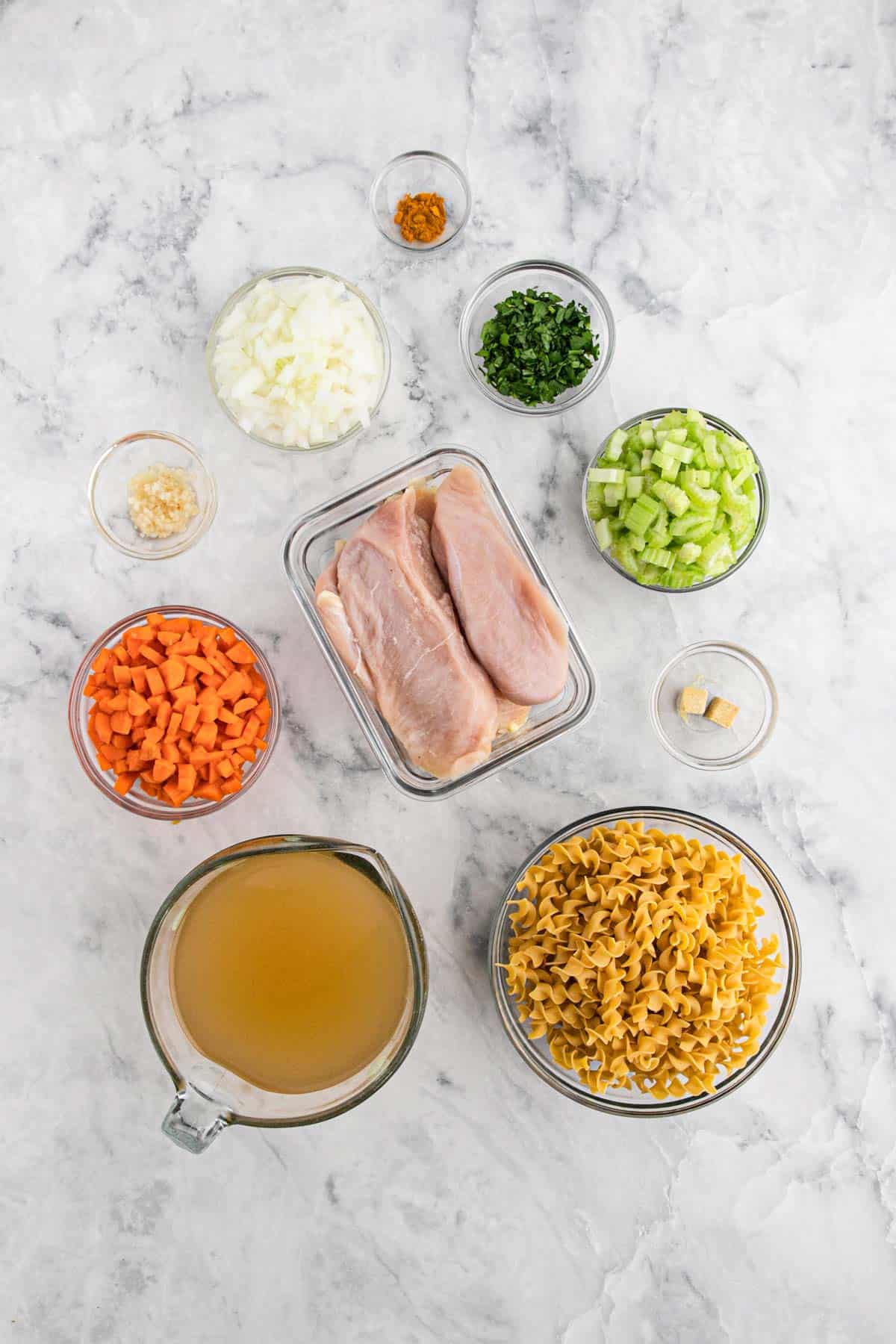 Ingredients to make crockpot chicken noodle soup.