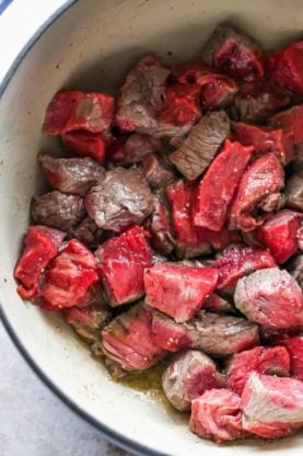 Tender beef tenderloins in a pot ready being cooked over oil