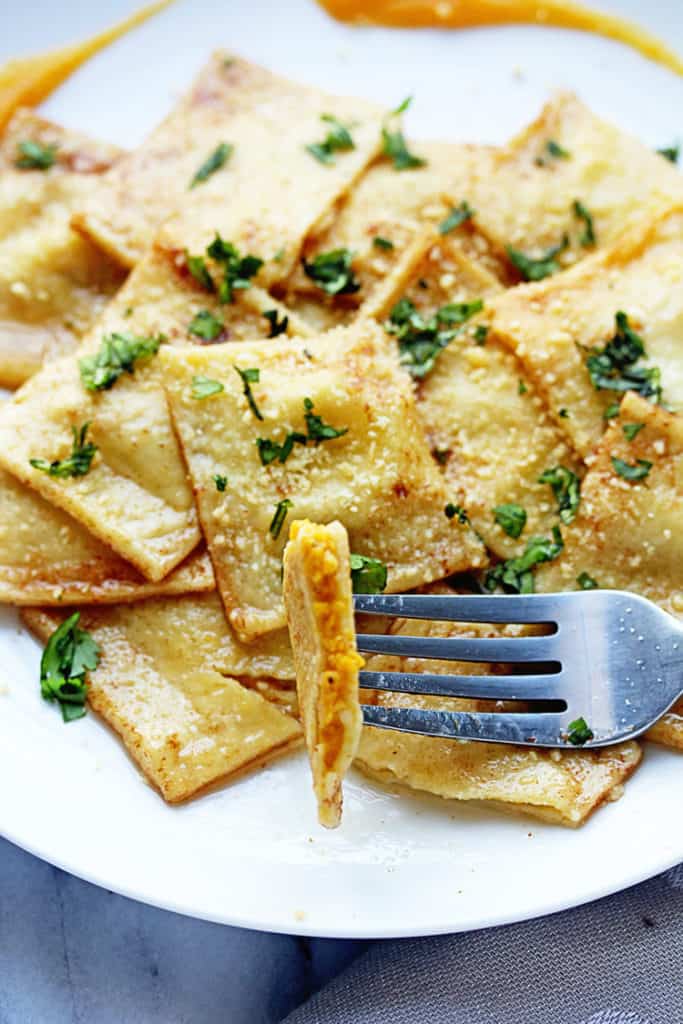 Close up of Butternut Squash Ravioli Recipe with pasta on fork being eaten