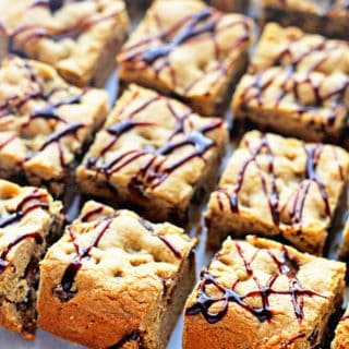 An overhead of chocolate chip cookie bars in three rows