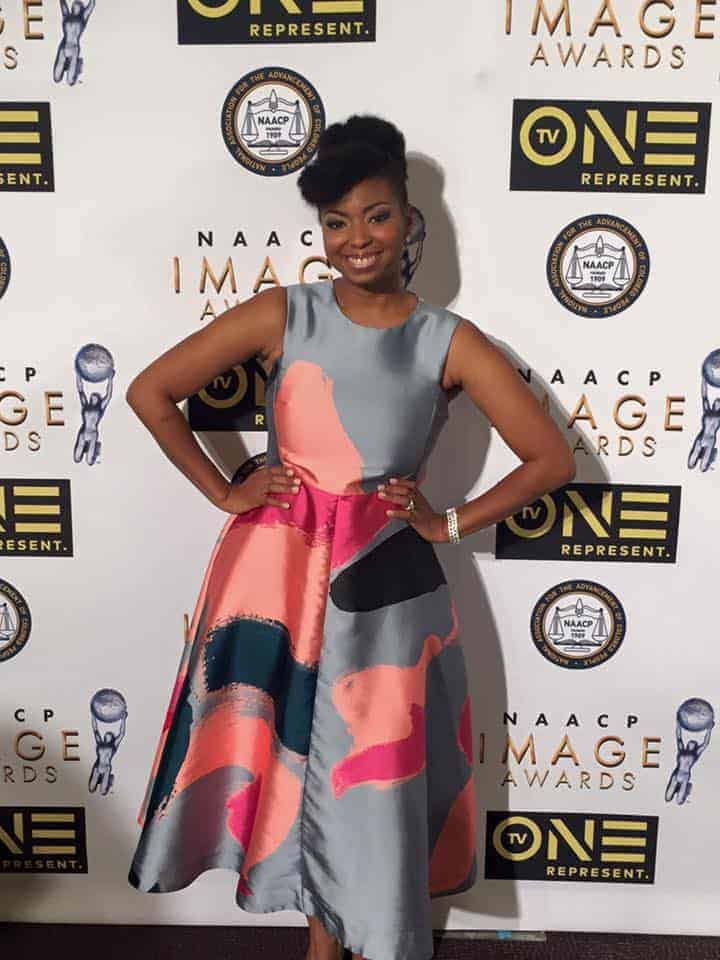 Jocelyn Delk Adams posing for a photo on the 2016 NAACP Image Awards red carpet