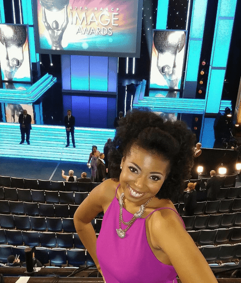 NAACP Image Award nominee Jocelyn Delk Adams poses for a photo from the balcony before the awards show filming