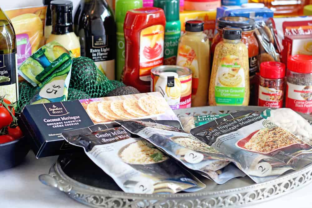 Several Signature brand products displayed on a white table