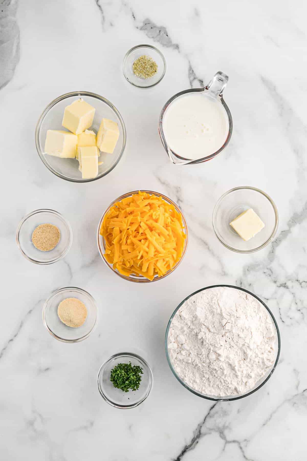 Ingredients to make copycat cheddar bay biscuits on the table ready to mix up.