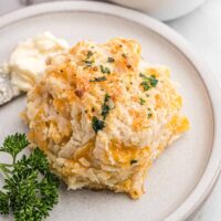 A cheddar bay biscuit on a plate.