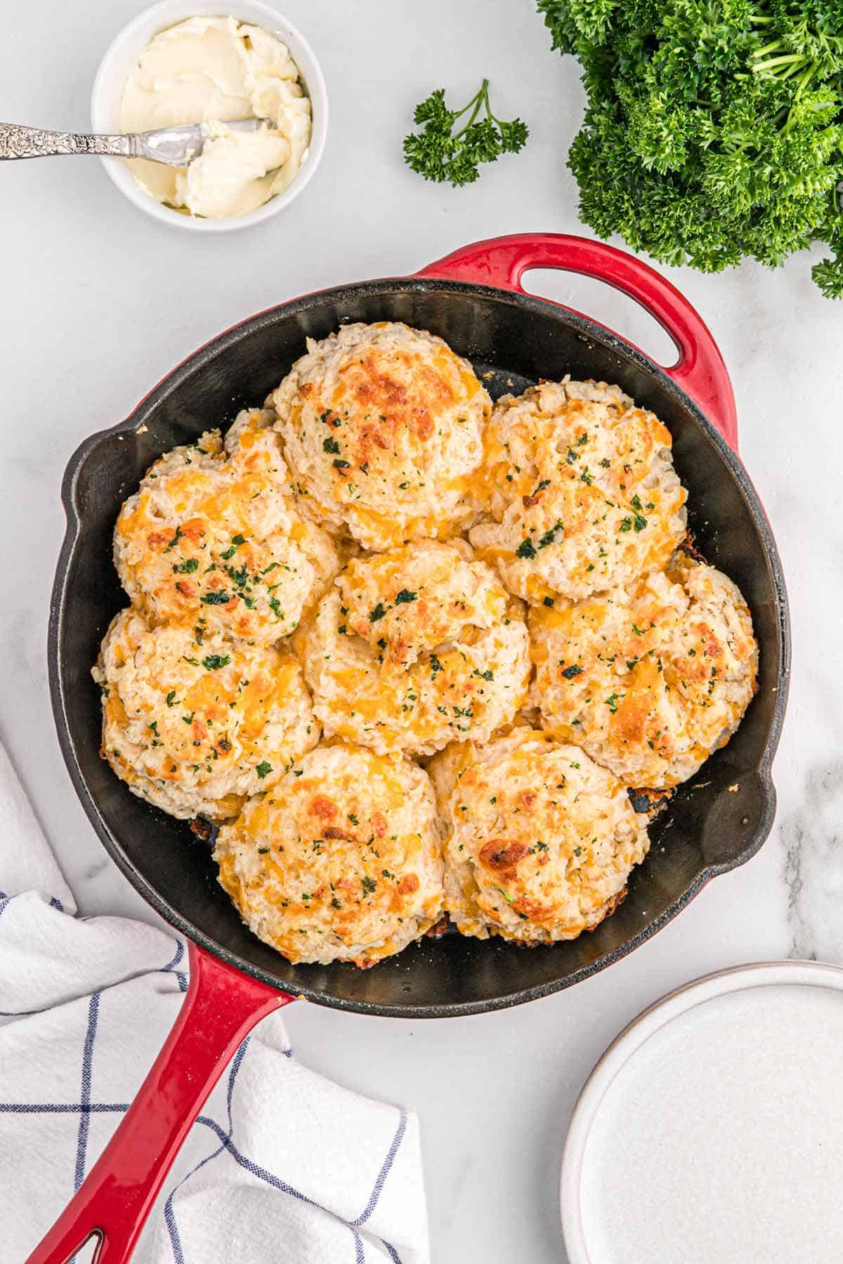 Baked garlic cheddar biscuits still in the pan.