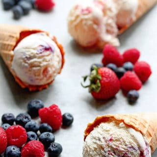Berry Ripple Ice Cream Recipe: The silkiest and creamiest homemade vanilla ice cream gets rippled with ripe seasonal berries such as blueberries and raspberries or any berry of your choice! | Grandbaby Cakes